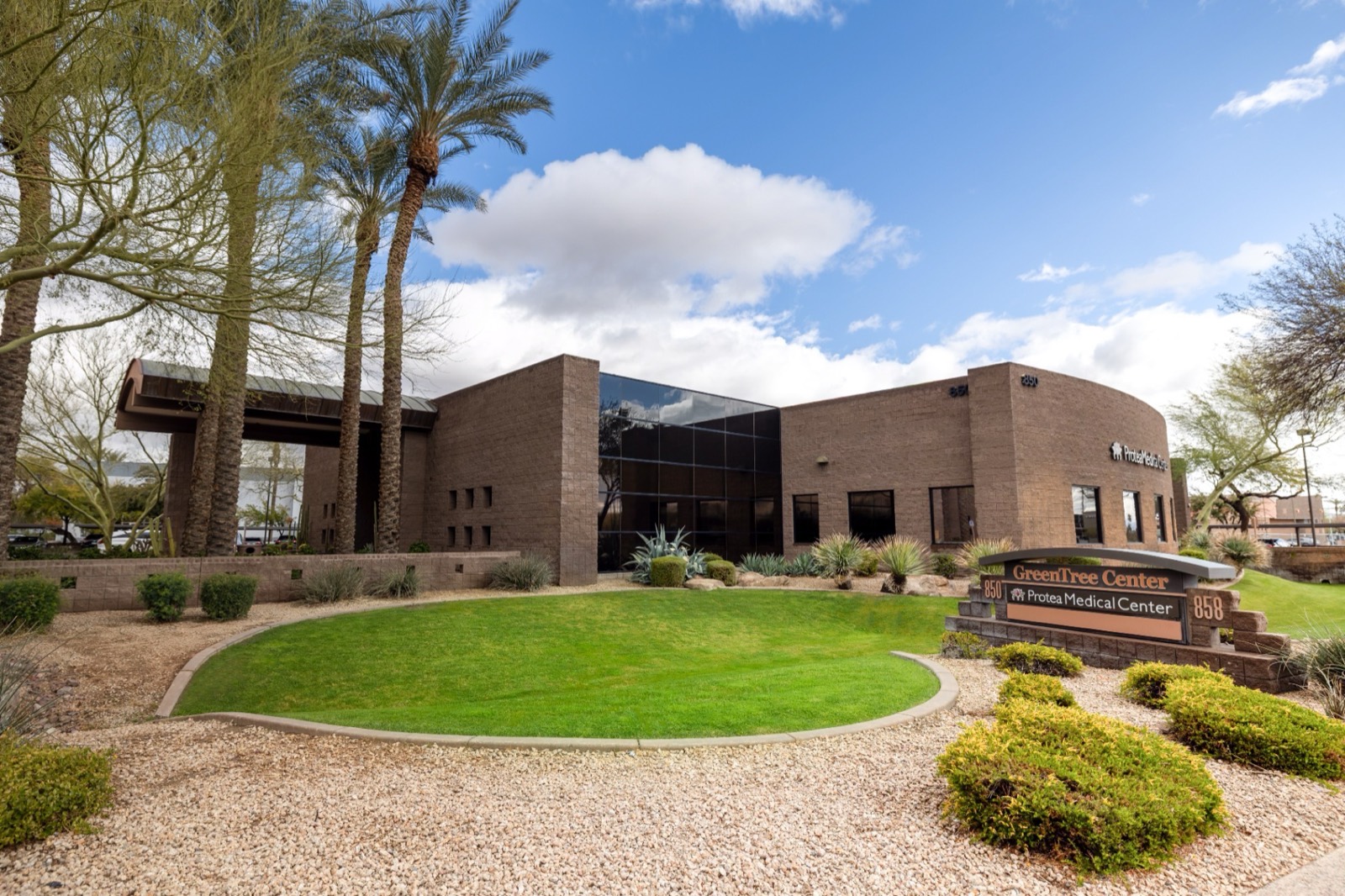 The Protea Life campus on W. Elliot Rd. in Tempe, framed by palm trees